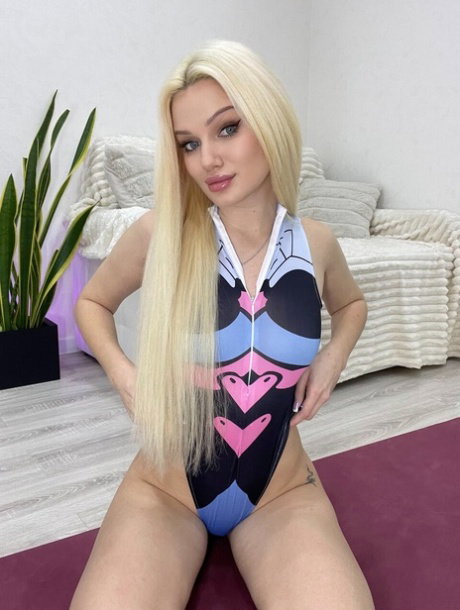 Solo girl with long blonde hair Your Diamond Queen poses on a yoga mat