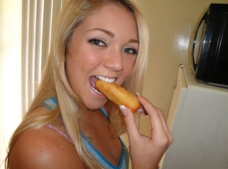 Young blonde Jessie Andrews rubs cum into her chest after fucking an old man