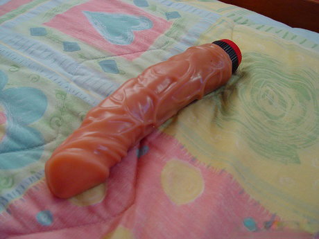 White solo girl Spring Thomas pleasures herself with fingers and a vibrator