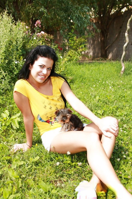 Smiling brunette with pretty face Ellis is having awesome time outdoor
