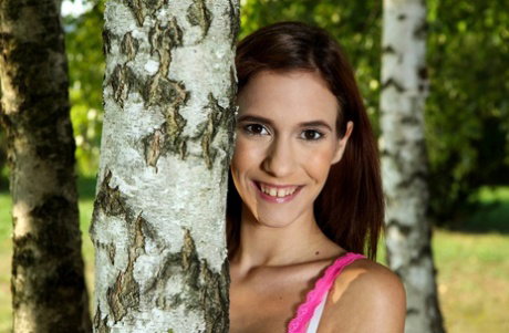 Young redhead Nikki Fox receives an external cumshot after fucking in the yard