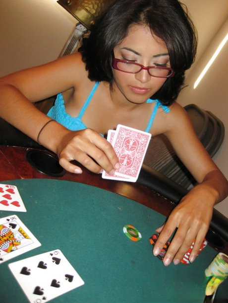 Latina babe in glasses Andrea Kelly strips to expose her slender body