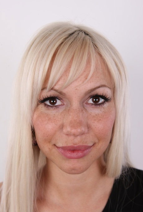 Blonde amateur with big areolas and freckles stands naked after undressing