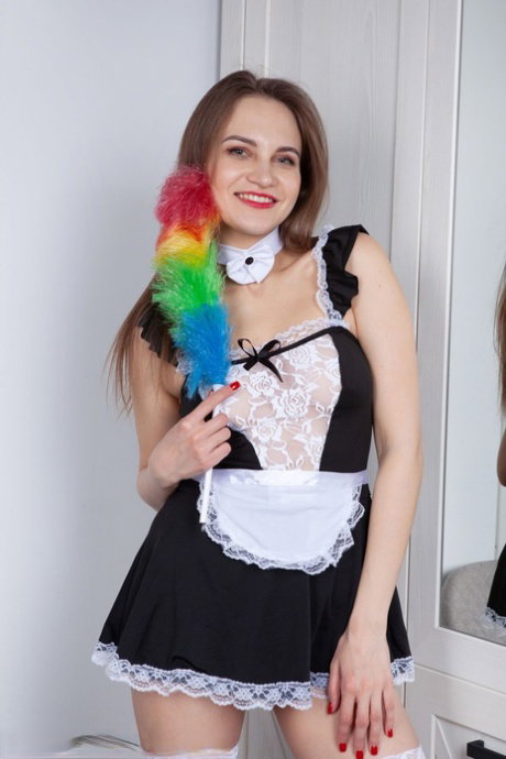 Over 30 woman Nika Dupre removes a maid outfit for her first nude poses