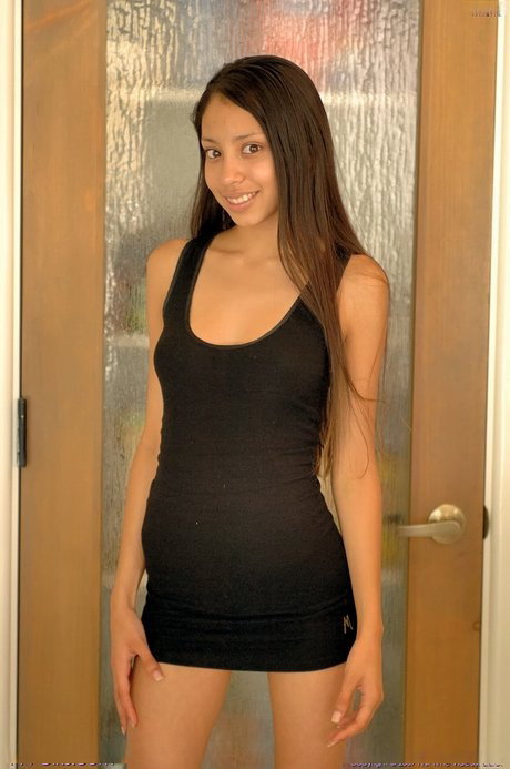 Petite amateur teen with a big ass Milena strips and poses in a solo