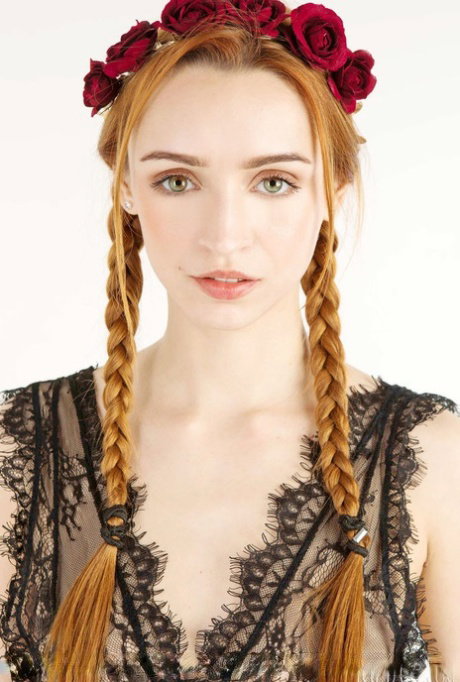 Beautiful redheaded teen Morrigan sports braided pigtails while getting naked