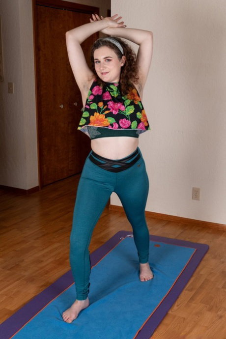 Chubby brunette Caralynn Rose strips & rubs her hairy muff on a yoga mat
