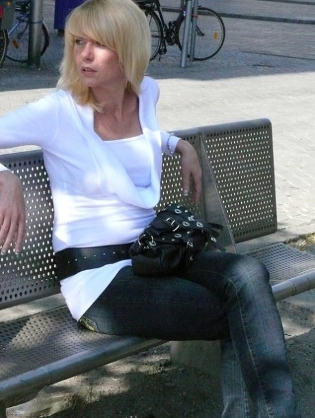 Blonde MILF strips to her stockings before masturbating with a vibrator
