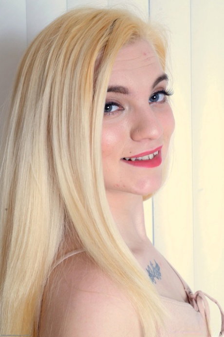 Petite blonde Crystal Young finger spreads her hairless pink pussy