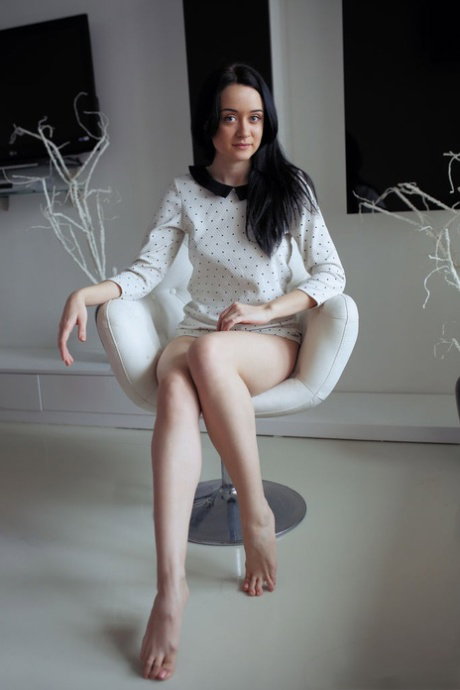 Dark haired teen Frona A plays with her tits while showcasing her perfect twat
