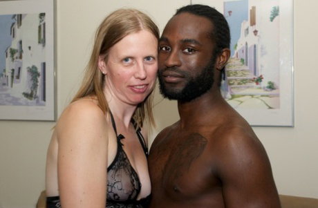 White amateur deepthroats her black lover's cock in lingerie ensemble