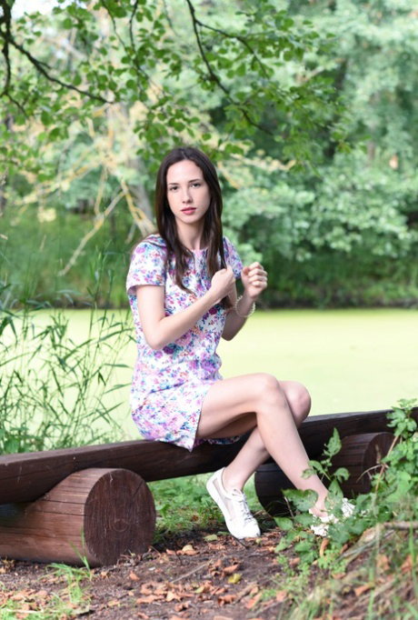 Solo girl takes off her bra and underwear while in a secluded location
