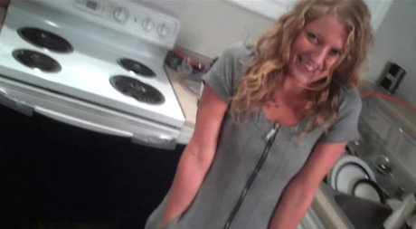 Cute blonde Tiffany swallows a cup of her own piss in a kitchen