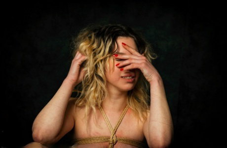 Restrained blonde Kama Medea has clothespins attached to her pussy
