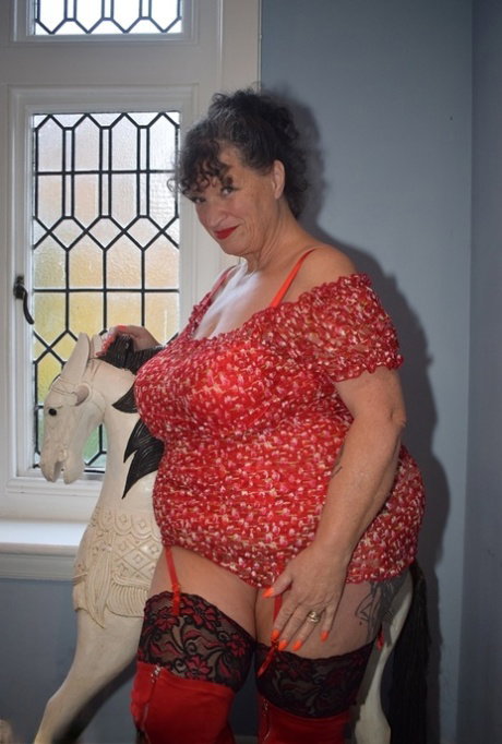 Fat granny shows her huge boobs and big ass in over the knee boots