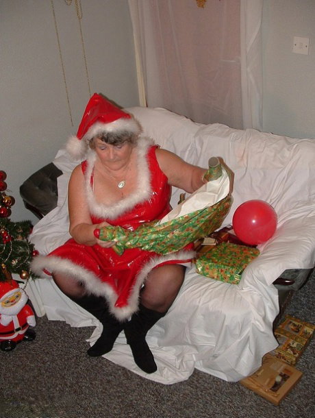 Obese nan Grandma Libby sucks and fucks Santa on a covered couch