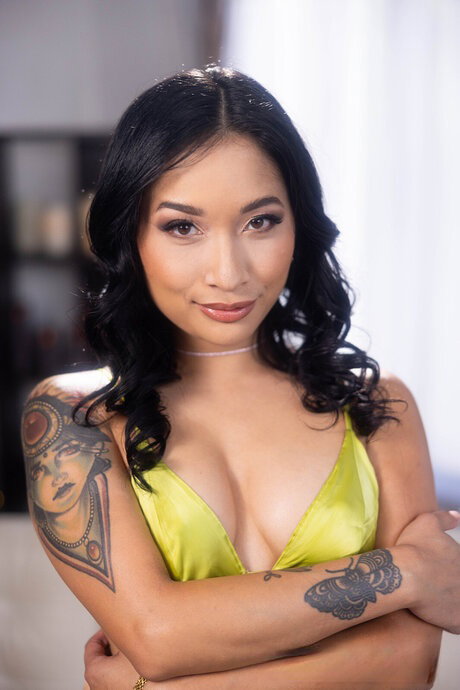 Tattooed Asian girl Avery Black has sexual intercourse with a big white cock