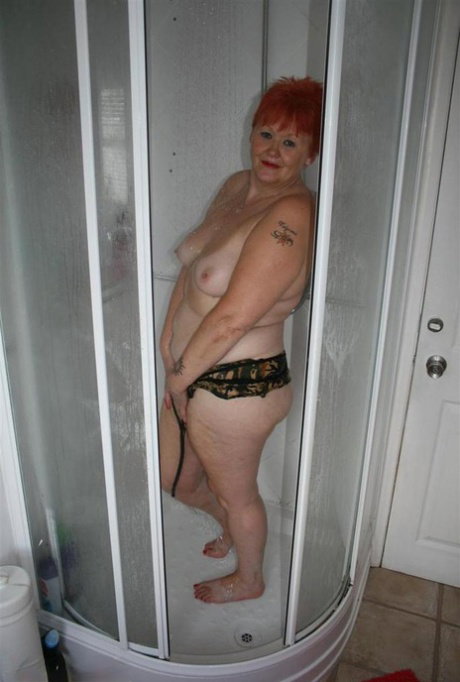 Mature redhead Valgasmic Exposed gets caught totally naked while in the shower