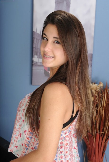 Magnetizing young teen elegantly undressing displaying her sexy butts
