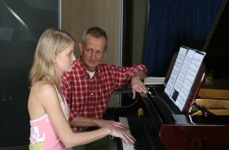 Young girl seduces her really old piano teacher during a lesson