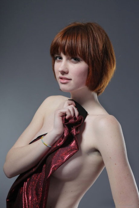 Naked skinny Bretta A poses on a studio chair showcasing her small perky tits