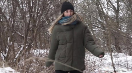 Blonde girl Masha takes a badly needed pee on snow-covered ground