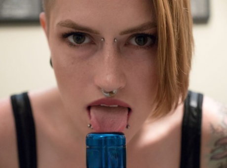 Solo girl with piercings Amanda Marie sticks a flashlight up her vagina
