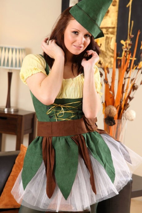 Sexy brunette Sarah T doffs her costume and unveils her big natural breasts