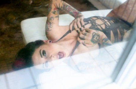 Ink queen Joanna Angel gets naked in front of her bedroom window
