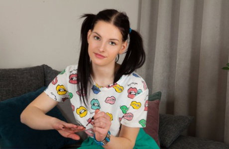 Young looking brunette Patricija gets naked with her hair in pigtails