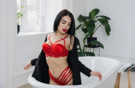 Skinny teen Tina shows off her hot ass and natural tits while posing in a solo