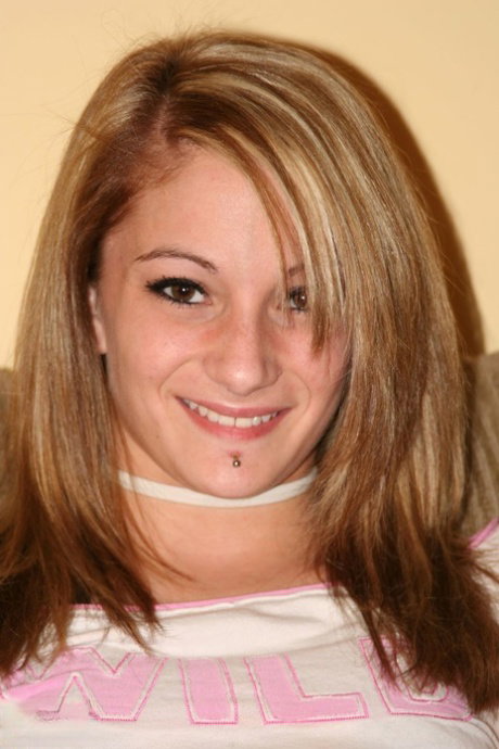 Pretty blonde amateur Leo with pierced lip flashes her naked boob