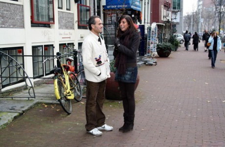 Visiting sex tourist pick up a couple of hookers from the red light district