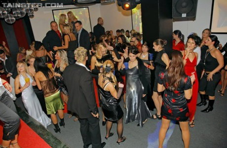 Hot party girls engage in a wild group sex inside a swing club