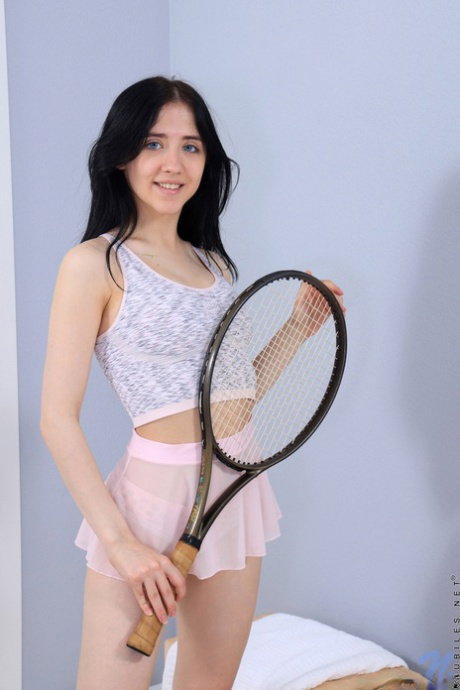 Petite brunette Emili Heads spreads her tight pink pussy in pink leg warmers