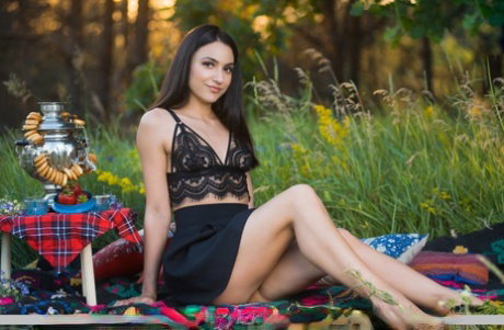 Nice teen Cira Nerri eats berries before getting naked on a picnic blanket