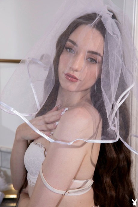 Beautiful bride Gia Rae shows off her big ass and her shaved pussy