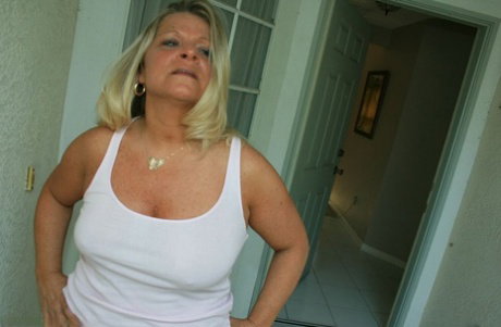 Mature woman Mrs Robonson jerks on a dick until it blows jizz on her face