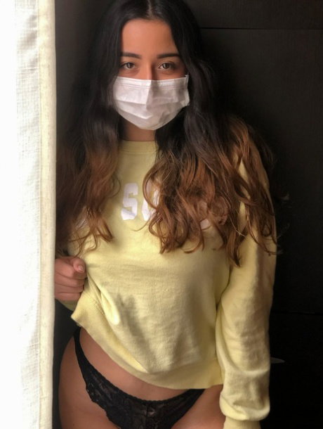 Brunette amateur babe exposes her big tits and poses in quarantine