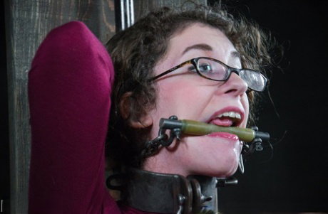 Rubenesque chick finds herself restrained and gagged in a pervert's dungeon