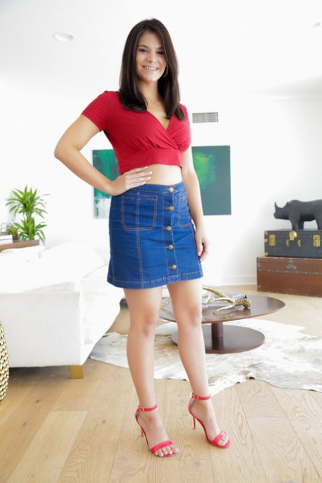 Brunette Latina Violet Starr stripping off denim skirt to pose naked