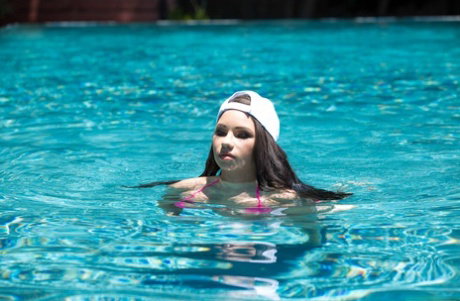Curvy brunette Raven Bay exposes her big tits & takes a boner anally poolside
