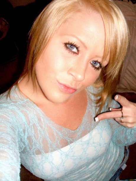 Blonde amateur takes teasing self shots while wearing a sheer top