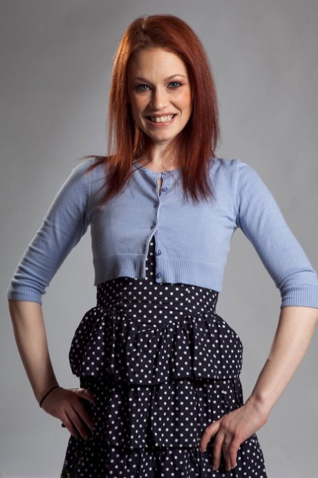 MILF redhead in pantyhose Justine Joli flaunts her natural tits in a hot strip