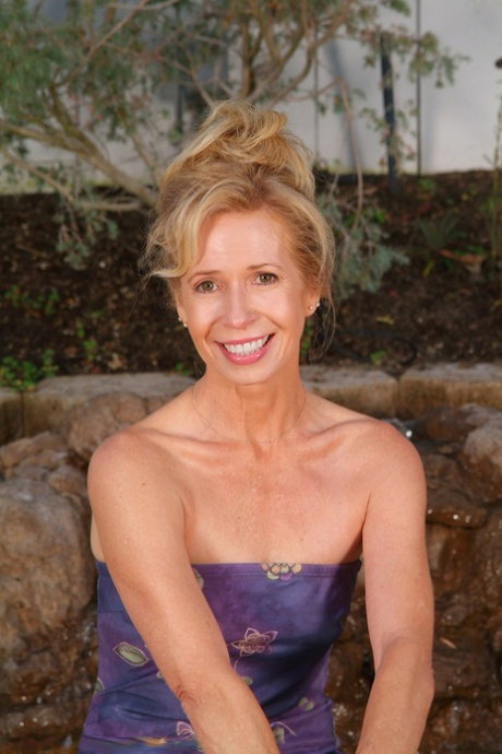 Petite MILF Marie-Kelly shows off her beautiful naked body outdoors