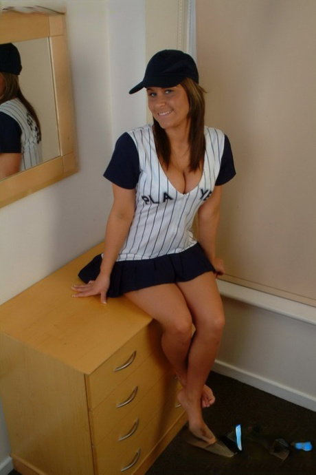 Busty Megan strips her baseball uniform to flaunt her lovely ripe breasts