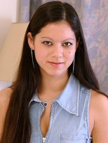 Pretty long-haired teen Marie slides a dildo deep inside her tight muff