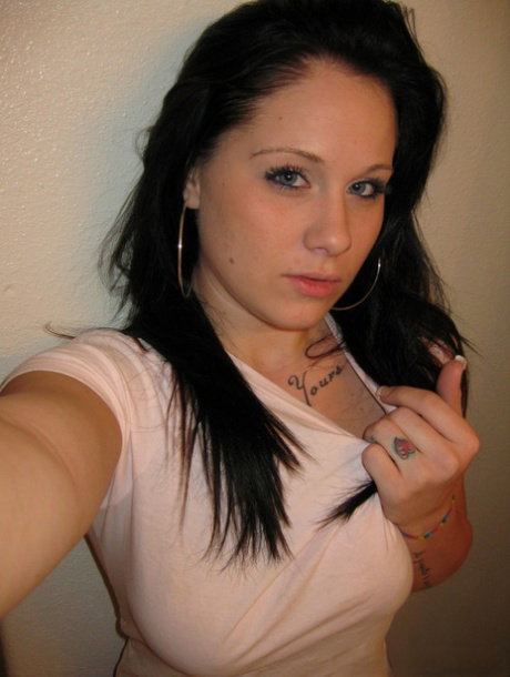 Kinky amateur Mia takes a photo of her massive natural tits in the mirror