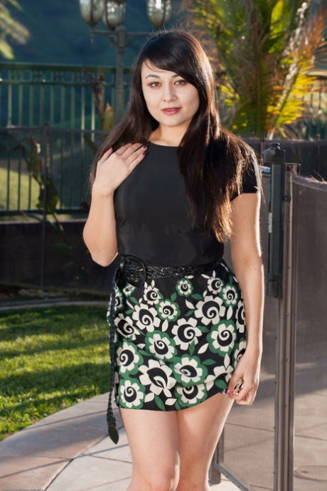 Asian girl with long dark hair Sophia Jade gets naked on a patio by herself