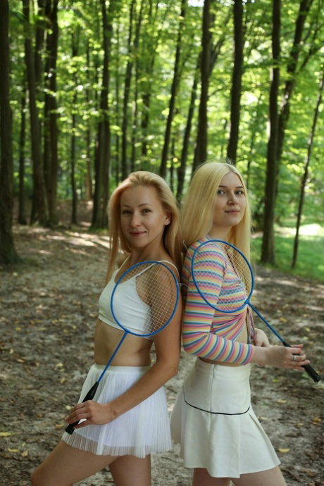 Young girls Sati & Suna get butt naked on a blanket in the woods
